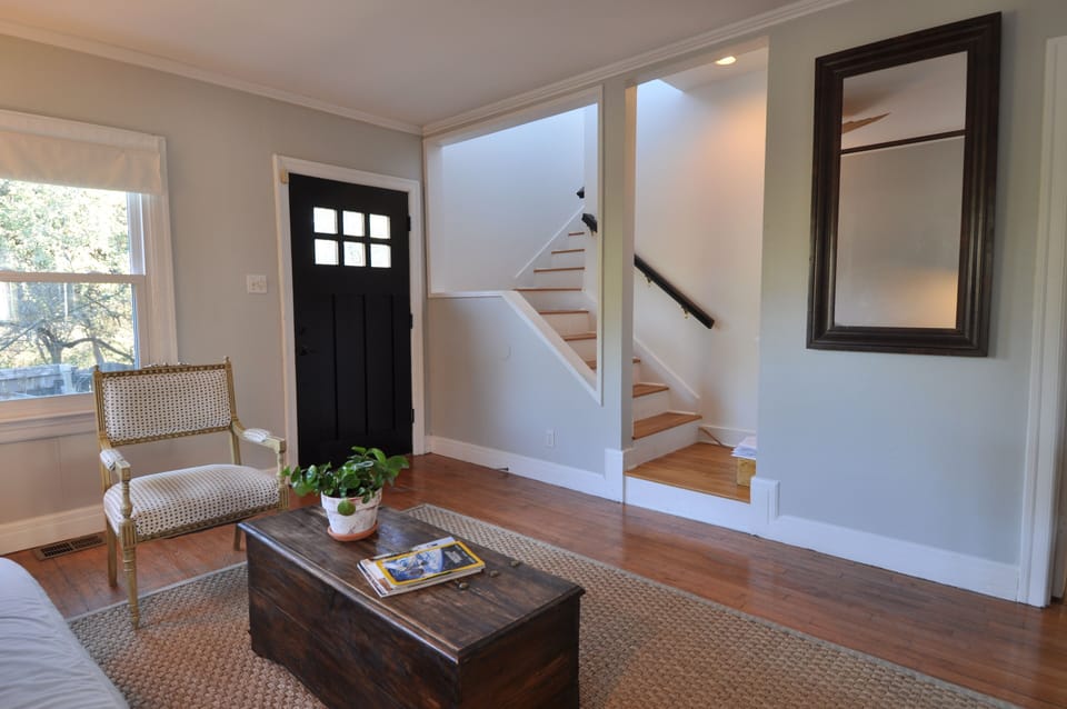 Front Entrance and Living Room with staircase to 2 story.