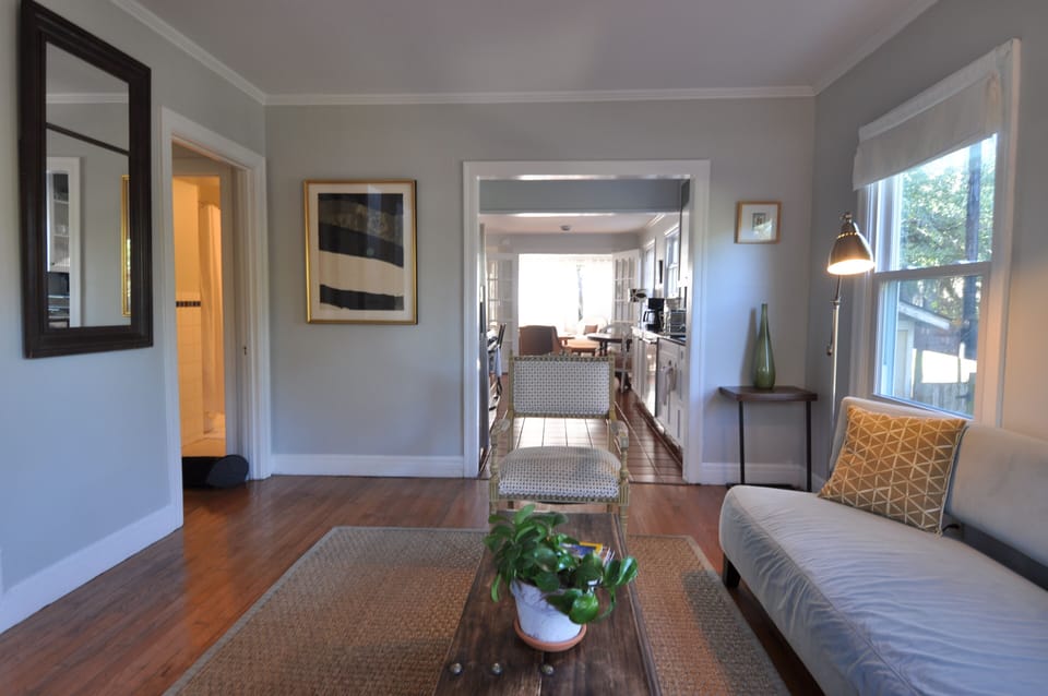 Entrance view from Front Door with hallway to full bath and downstairs bedrooms