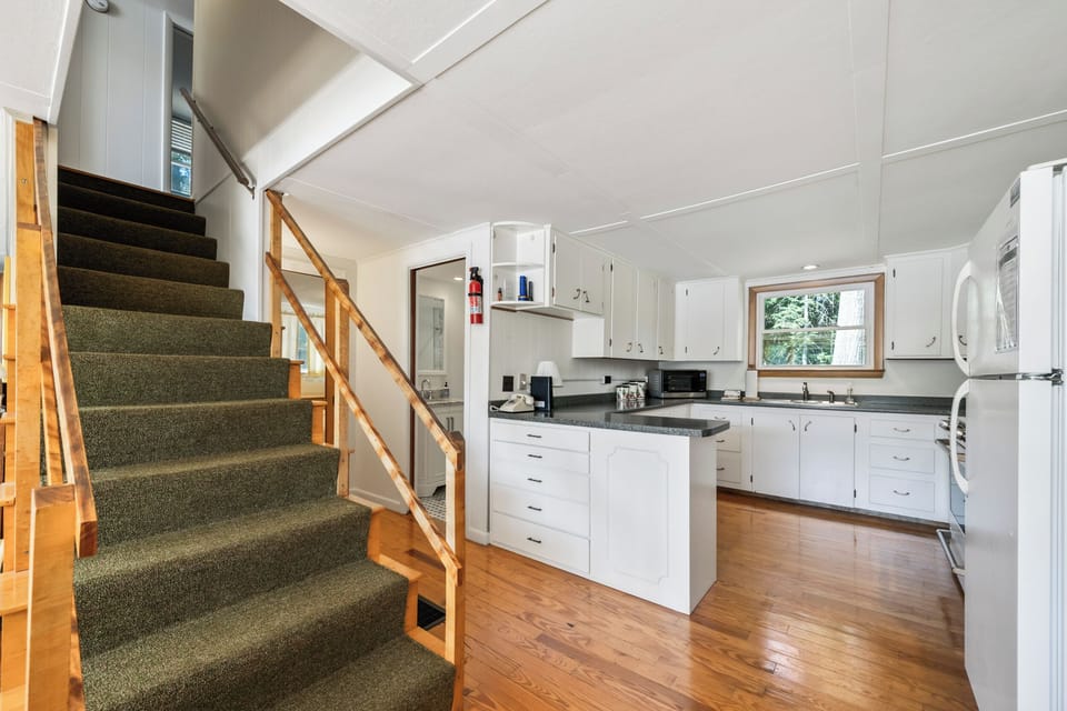 View of kitchen with stairs to upper level