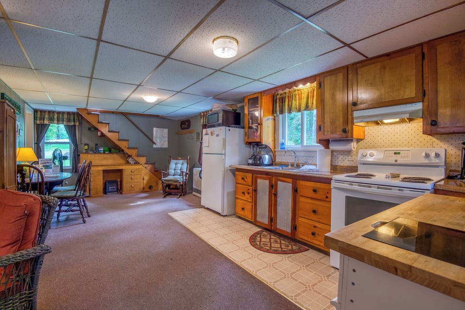 Kitchen, dining area, and steps to loft