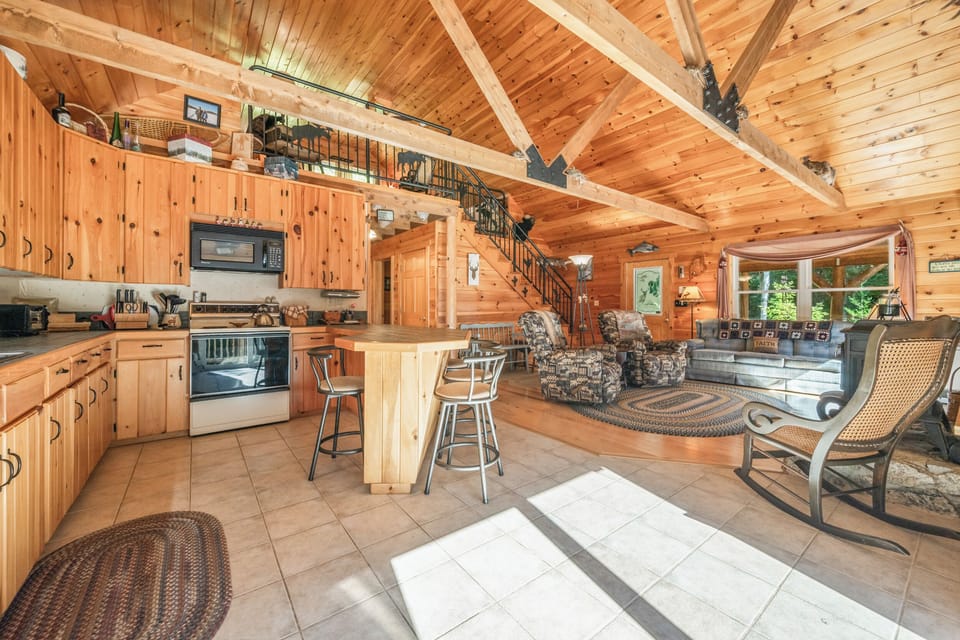 Spacious main floor with kitchen, living area, and loft