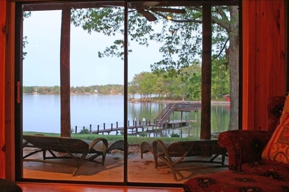Outdoor Lounge Area with Tranquil Private Lake Views.
