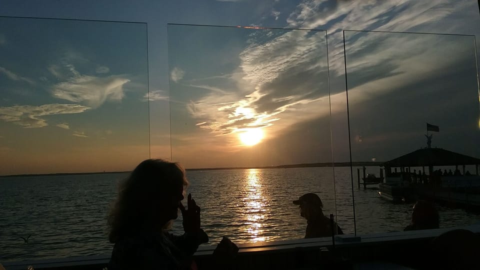 Dining out and watching the sunset over Assawoman Bay