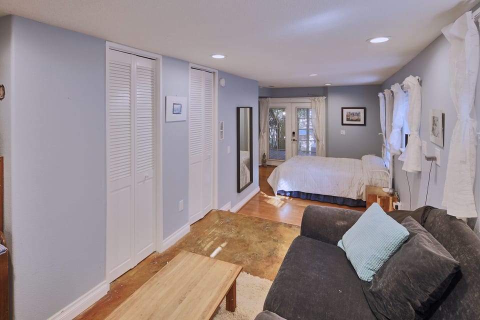Other side of downstairs TV room French doors open to hot tub