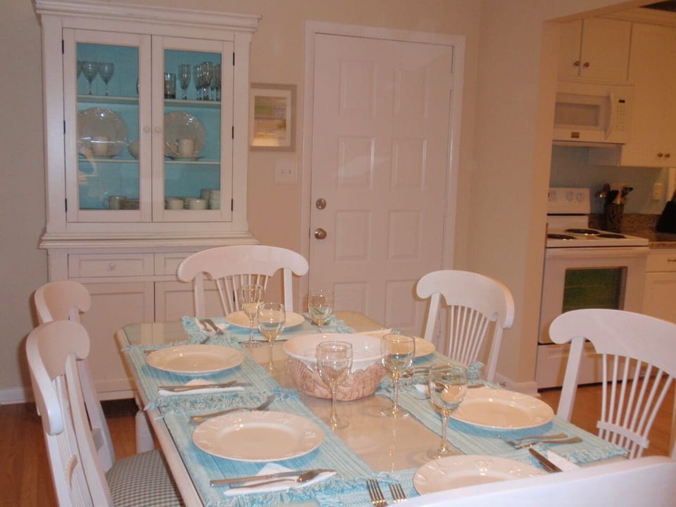 The dining room table can seat up to 8 people.