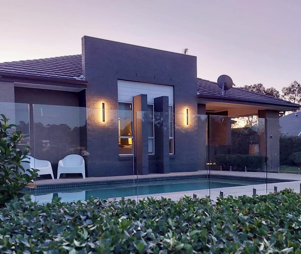 Glass framed pool overlooking the golf course
