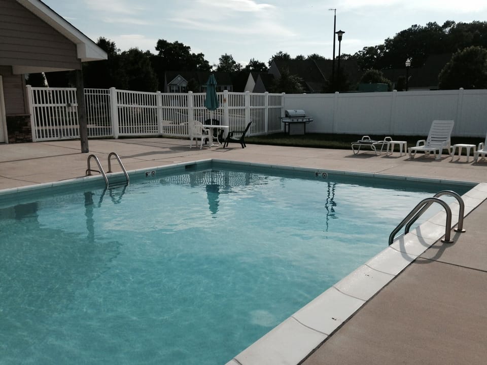 Pool conveniently located directly next door to our home and gas grill.