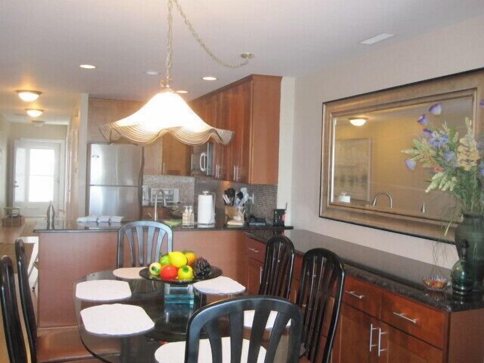 Spacious dining room seats six and overlooks the ocean.