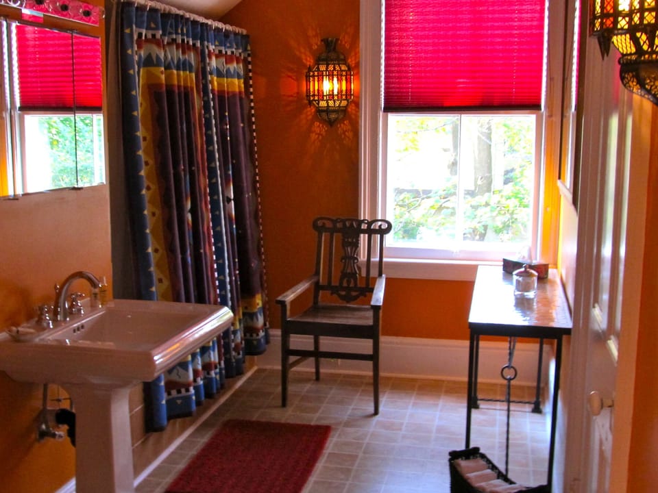 The main bathroom upstairs with large tub and shower.