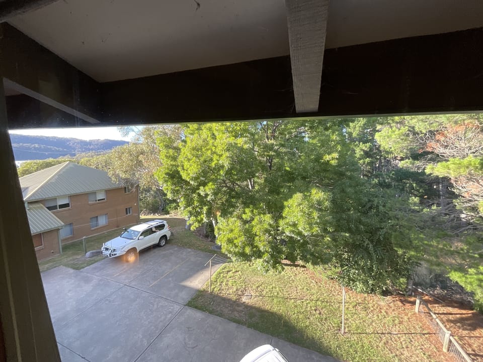 Level 2 Main Bedroom view to rear car park and lake.