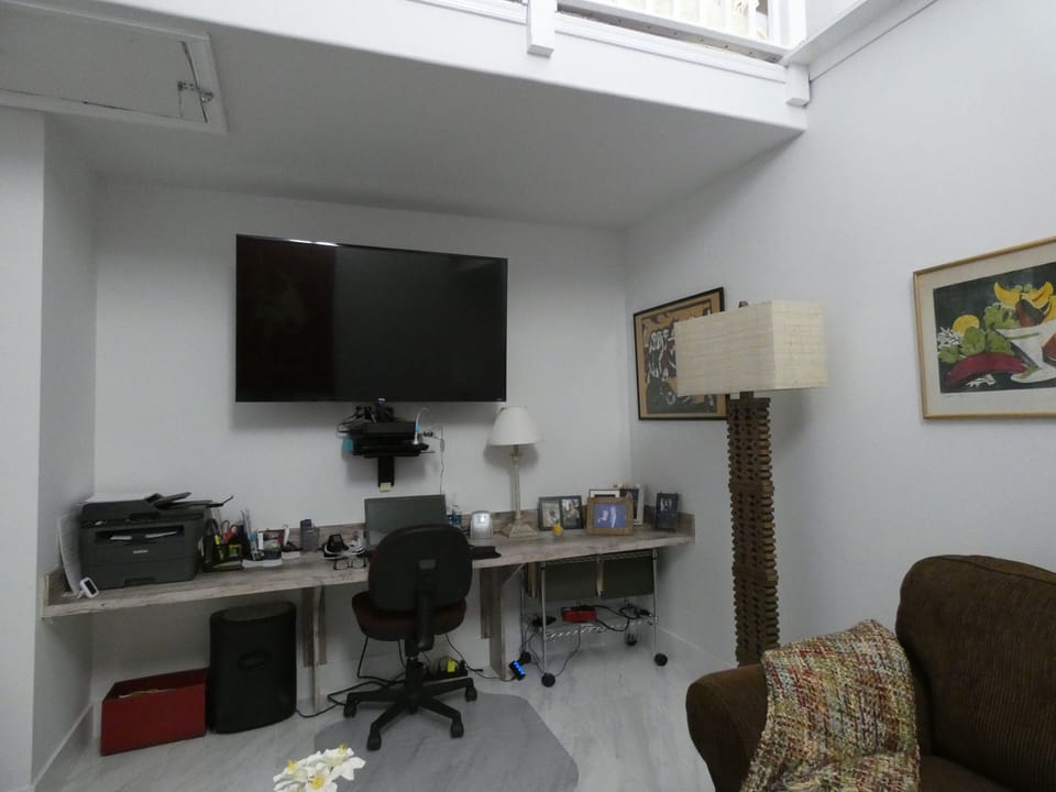 den - home office with desk chair & shredder