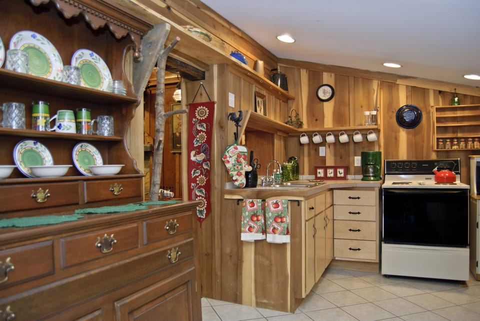 China hutch with service for four next to kitchen