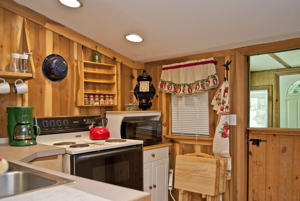 Kitchen with access to bedroom