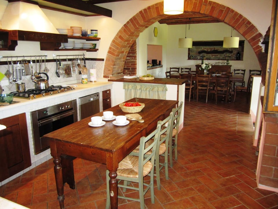 Kitchen with antique farmhouse table, and all new appliances.