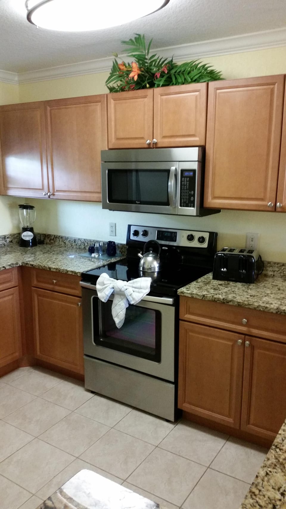 Kitchen cabinets, stove and microwave