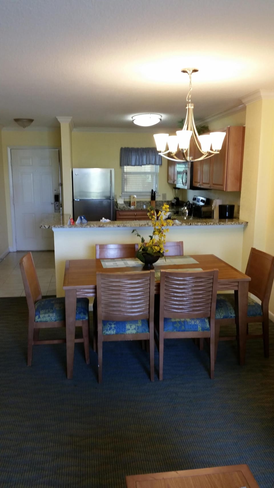 Dining area, kitchen and entry door.
