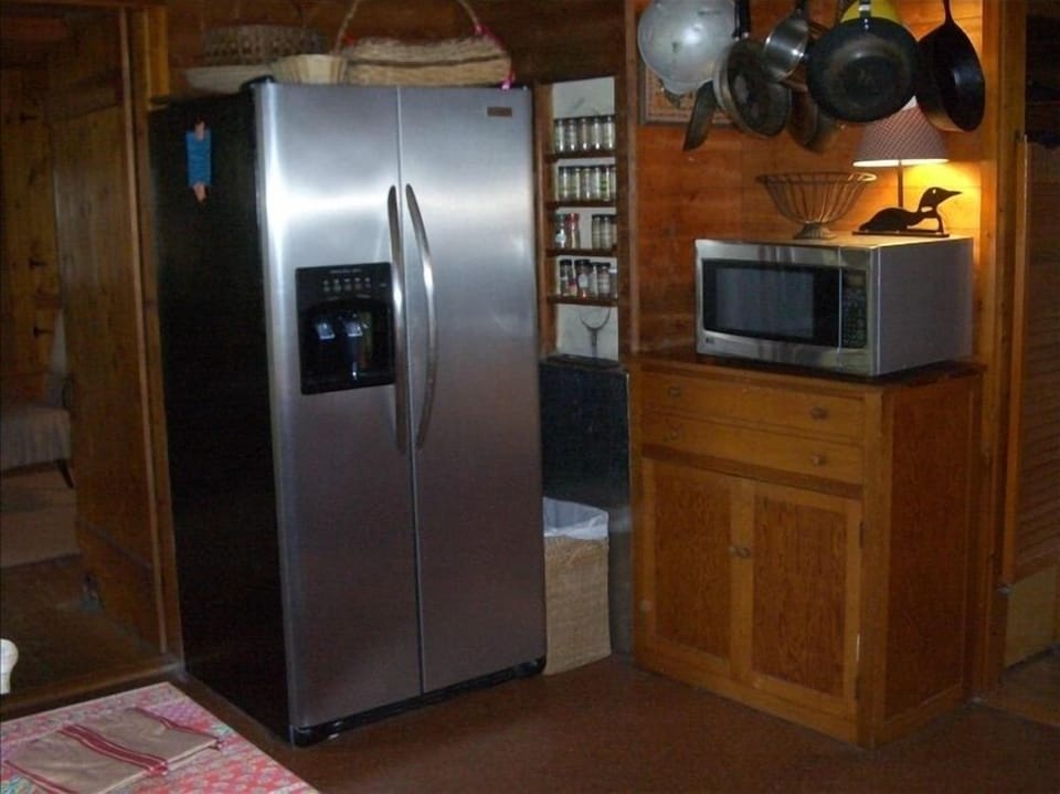 Country kitchen featuring modern appliances.