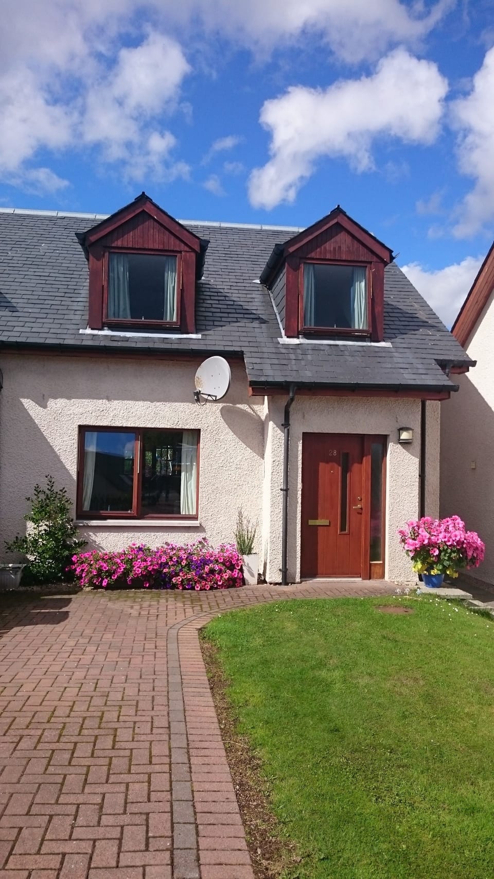 Front of House, with Driveway for two cars. 