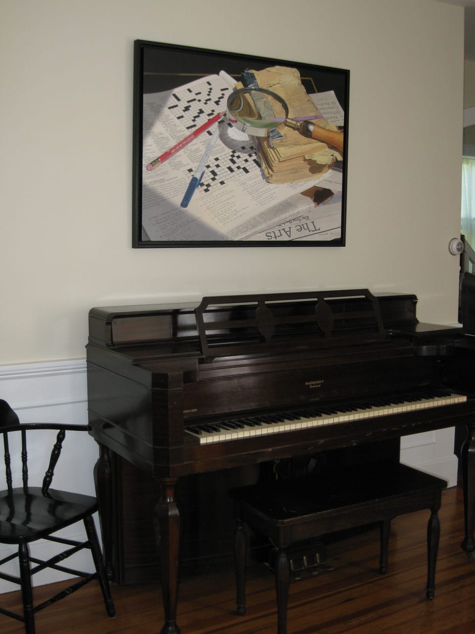 Living room piano with artwork by artist and friend Steve Mills
