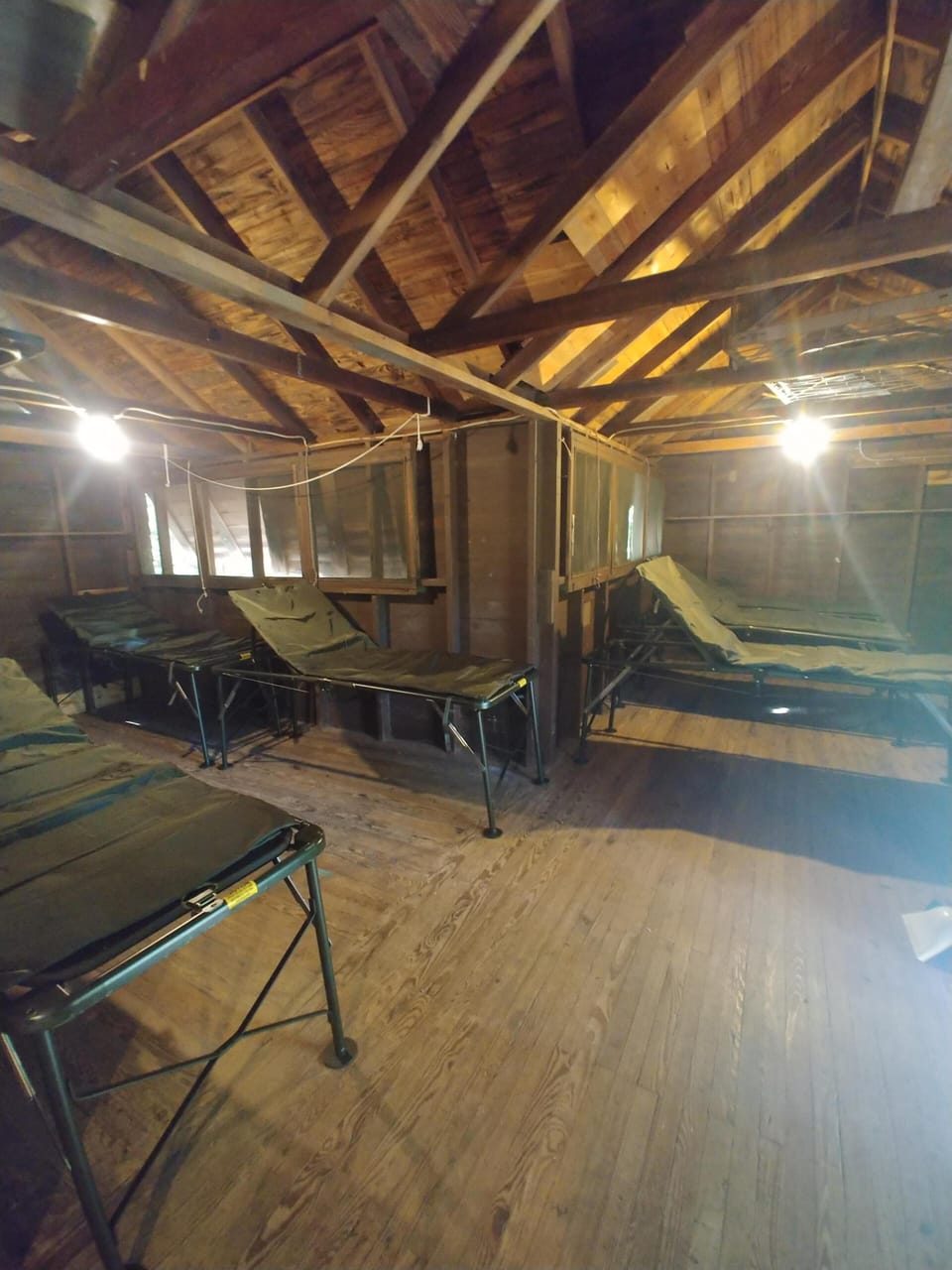 One of the three rustic cabins with cots sleeps 11, other 2 singles & bunks