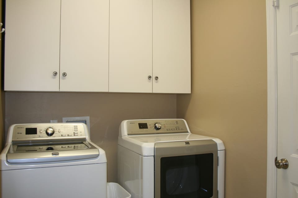 Laundry room with full size washer and dryer.