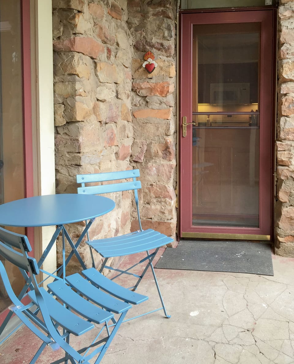 Enjoy your own covered outdoor seating at the apartment's entrance