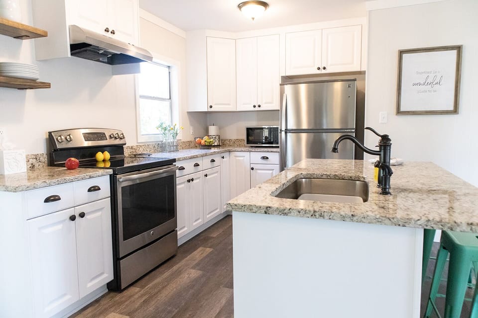 The spacious kitchen has new (and sparkling clean!) stainless steel appliances.