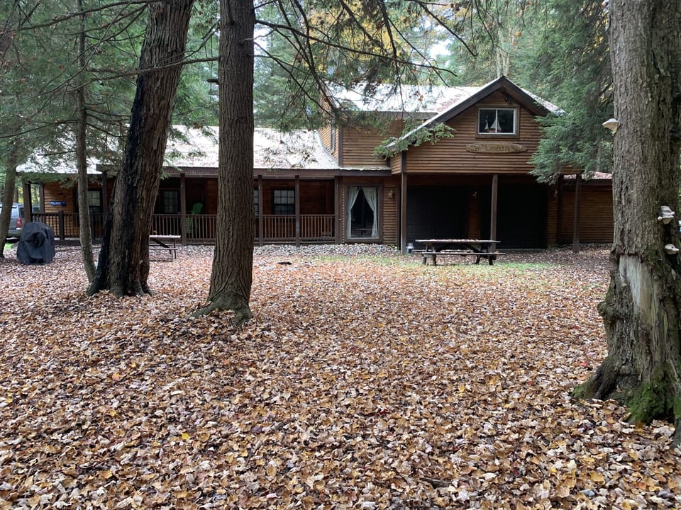 Front of house with firepit and picnic table 