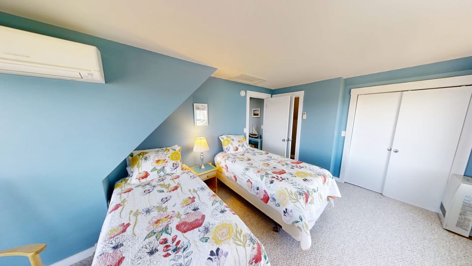 Second level bedroom with 2 twin beds.