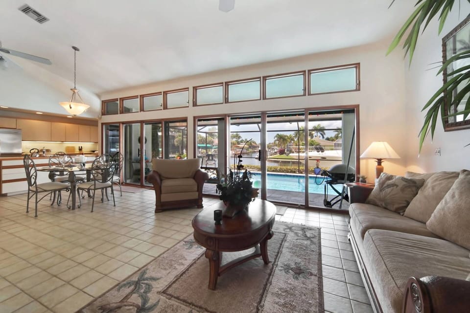 View of pool and kitchen from living room