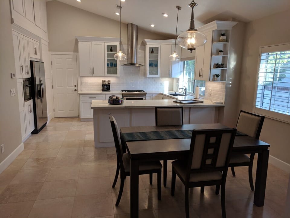 Fully equipped kitchen with gas stove and stainless steel appliances