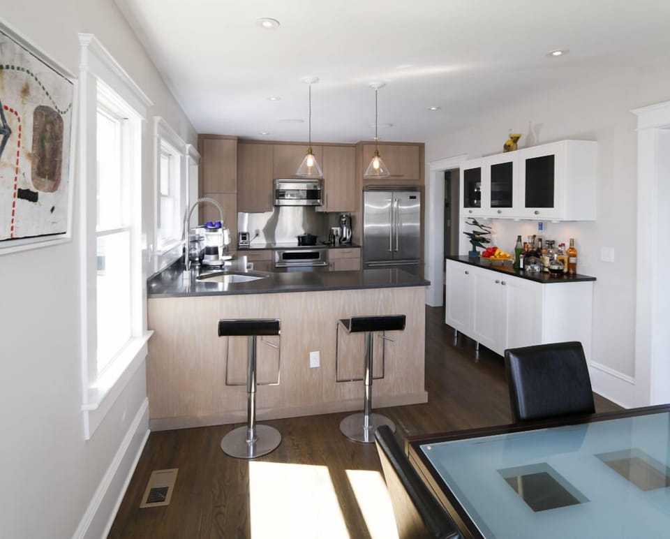 Gourmet kitchen with stone counter-tops and high-end stainless steel appliances