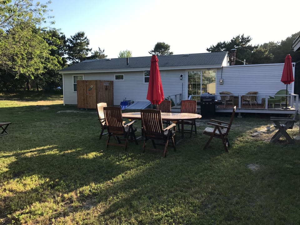 our backyard with teak table and chairs