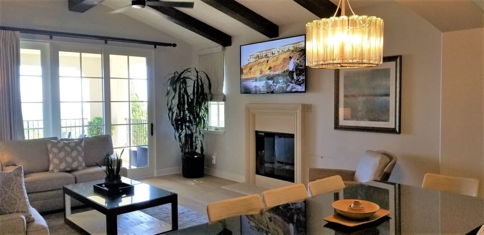 Spacious Living Room, Dining Area, Fireplace, and 60 " HDTV