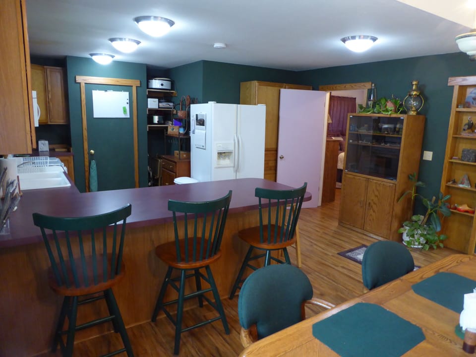 Breakfast bar and oak dining table for six
