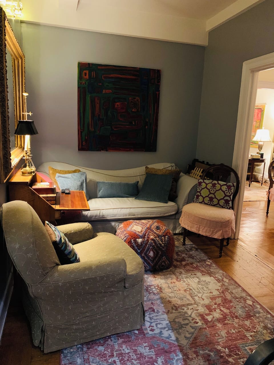 Den adjacent to Foyer. Foyer leads to Living Room.