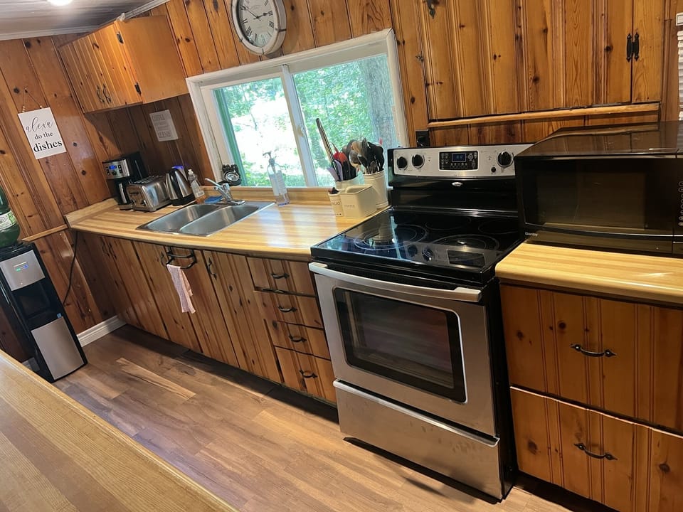 Kitchen with stove, dishwasher, microwave, coffee maker, toaster, and more...