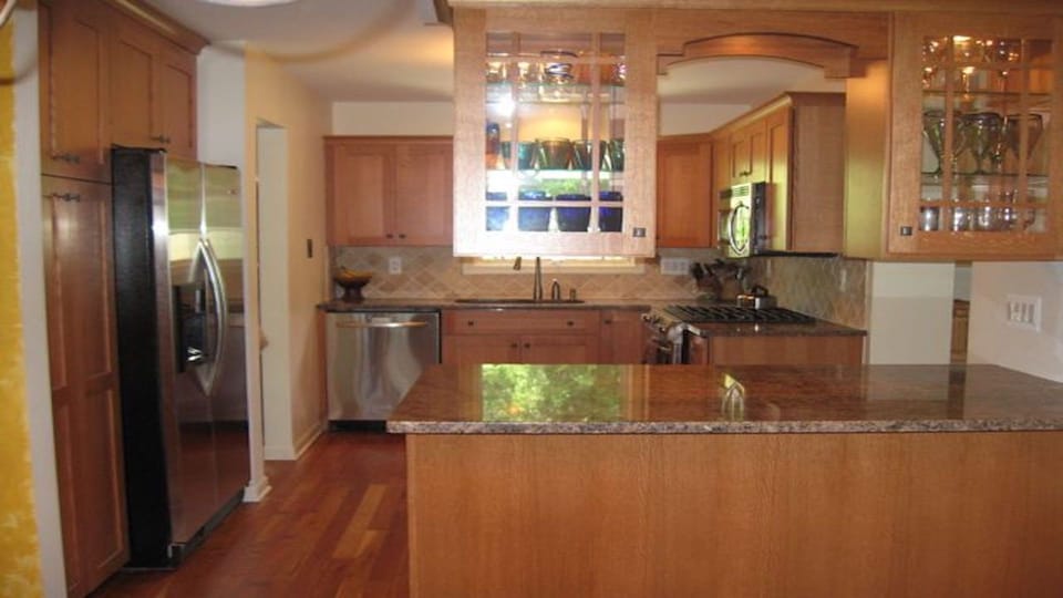 Kitchen with island between kitchen and dining room