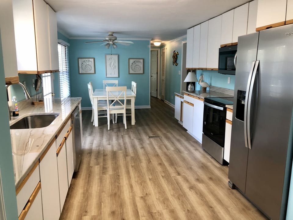 Renovated 2020. New flooring, appliances, & kitchen opened up with tons of space
