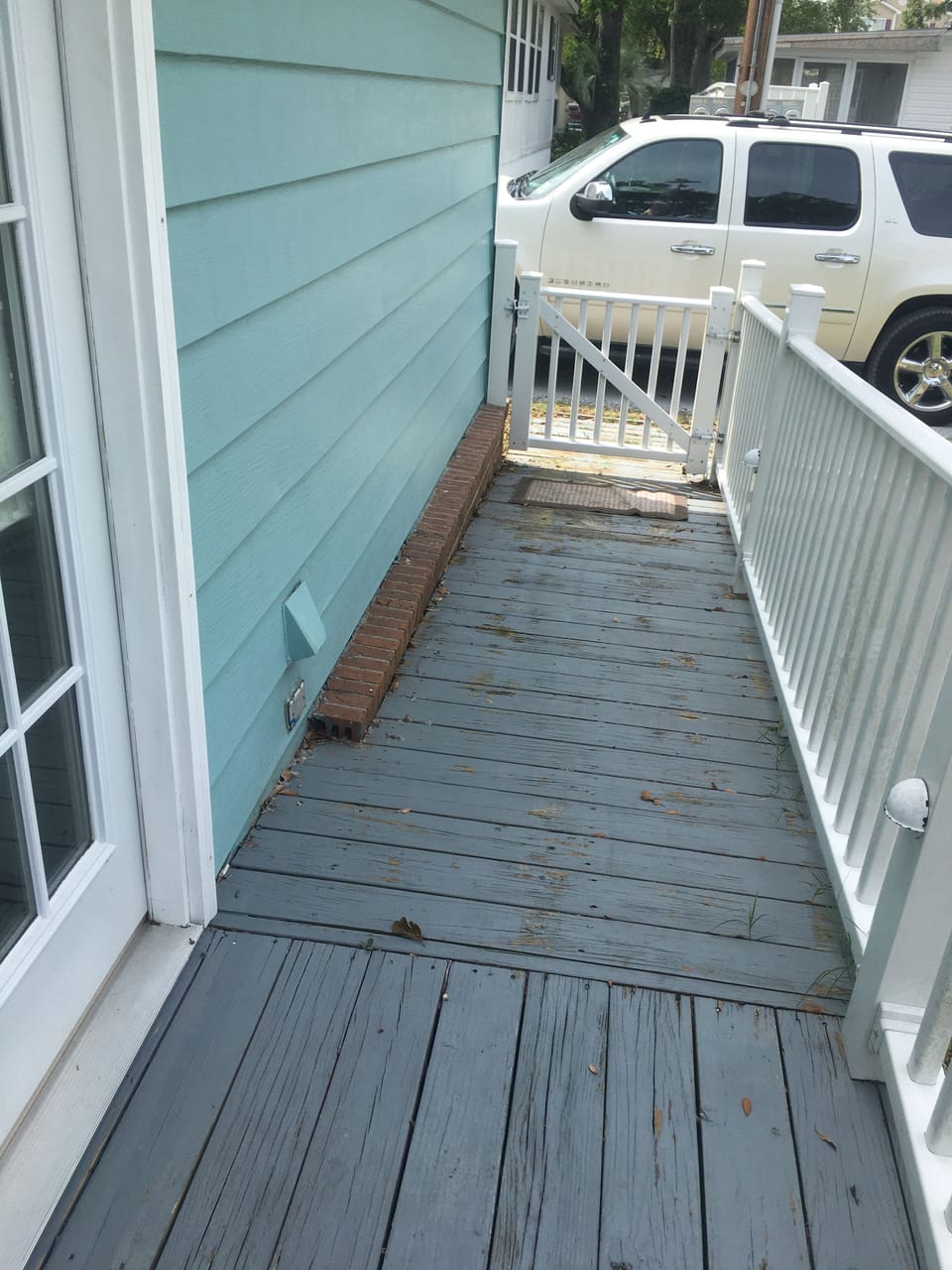 Wheel chair ramp accessible from small road behind the home