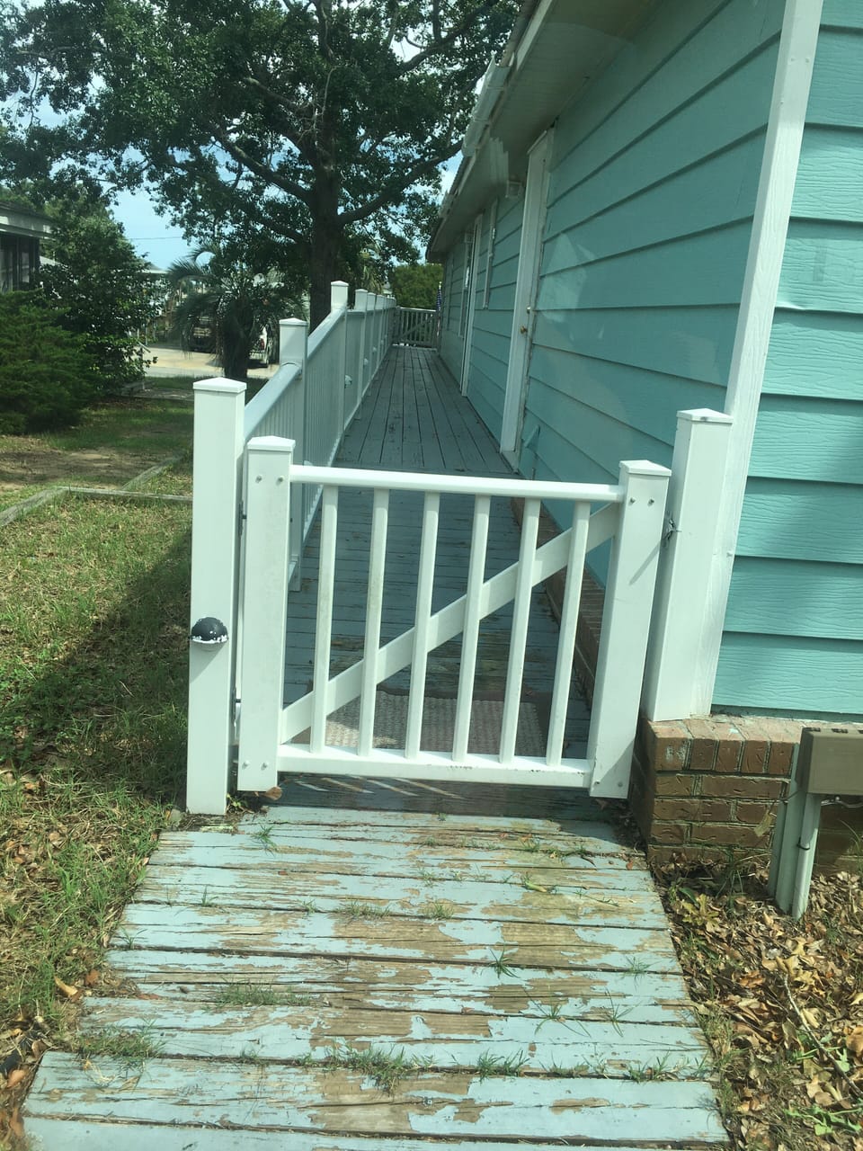 Wheel chair ramp accessible from small road behind home