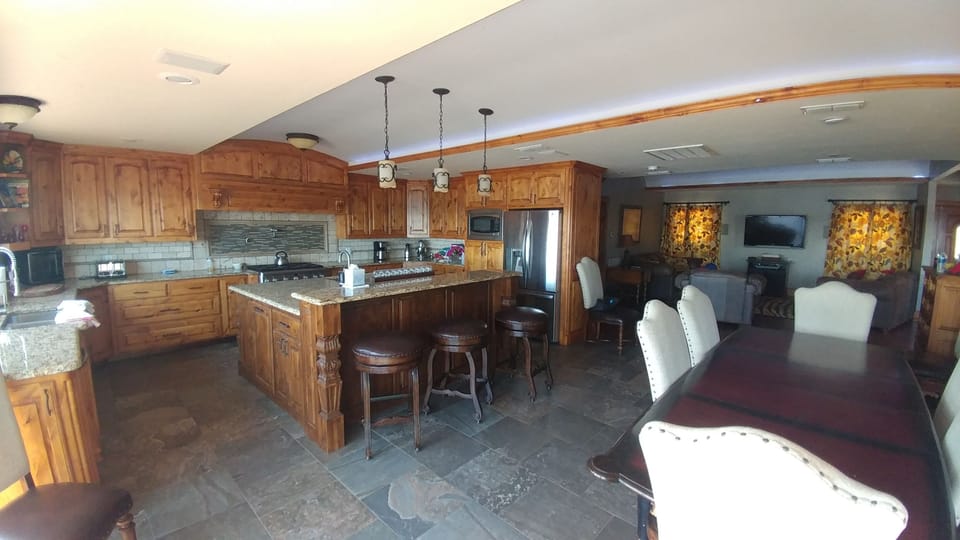 Kitchen and dining area, looking towards living room. 