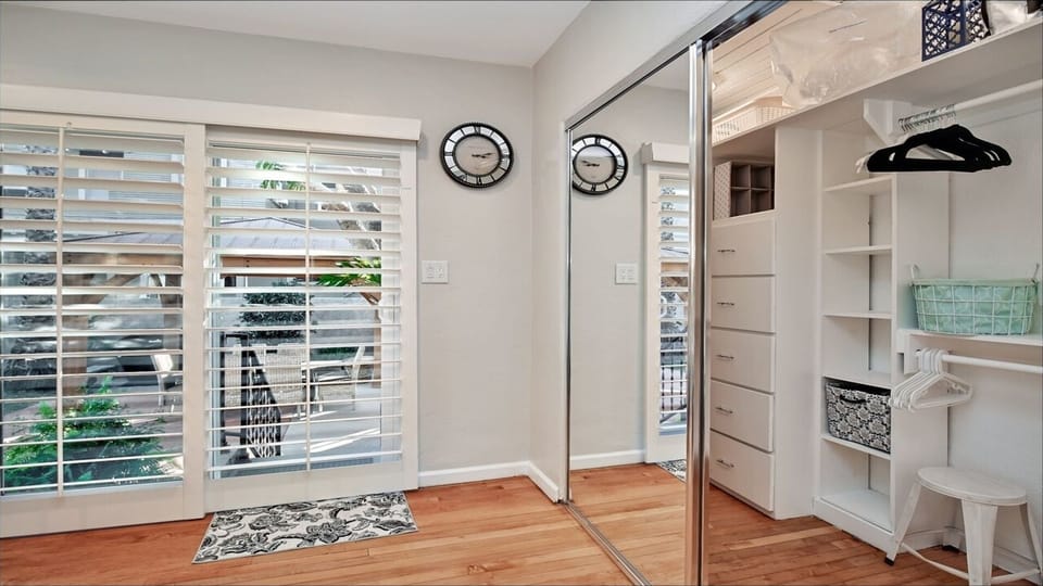 Master Bedrm:  large walk in closet, sliding doors / shutters to courtyard