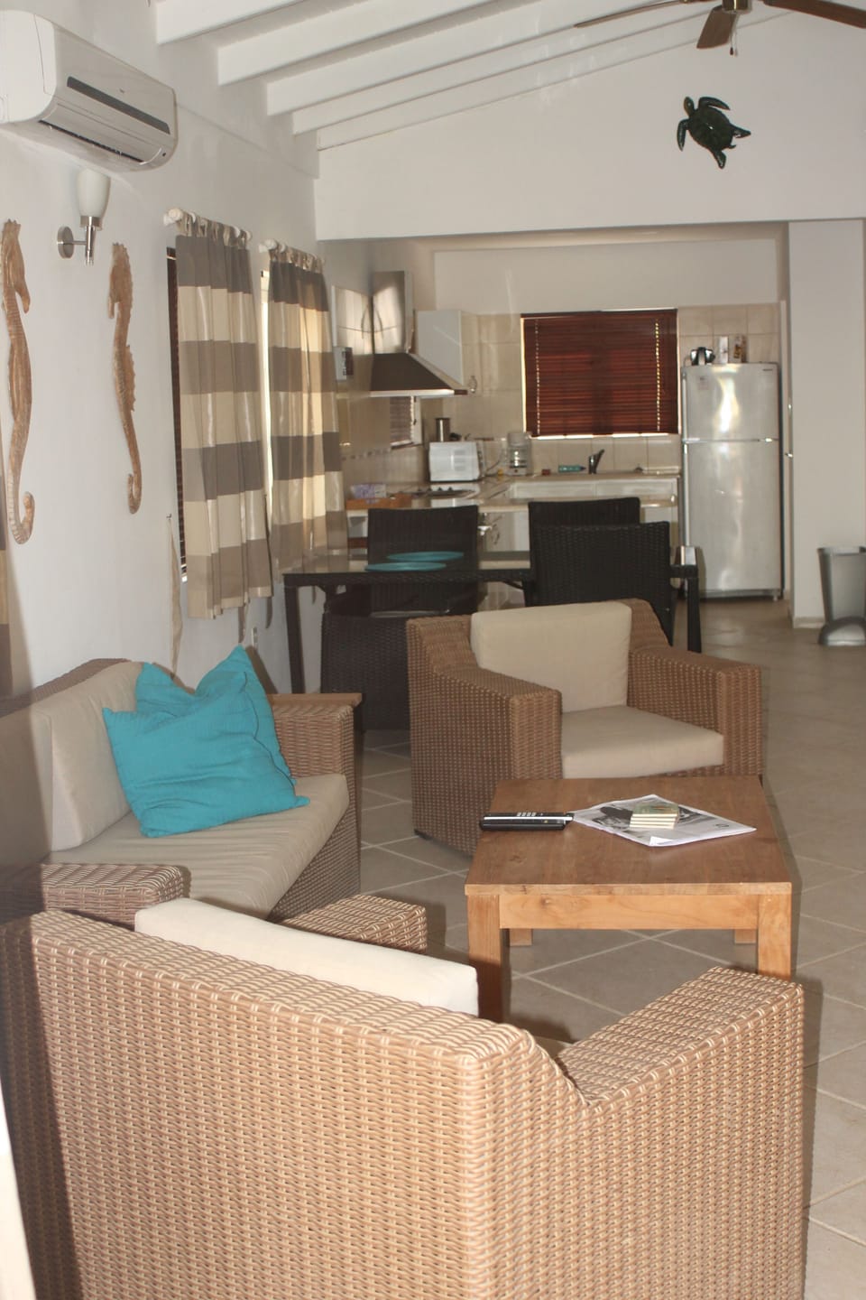 View of the open format living room, dining and kitchen