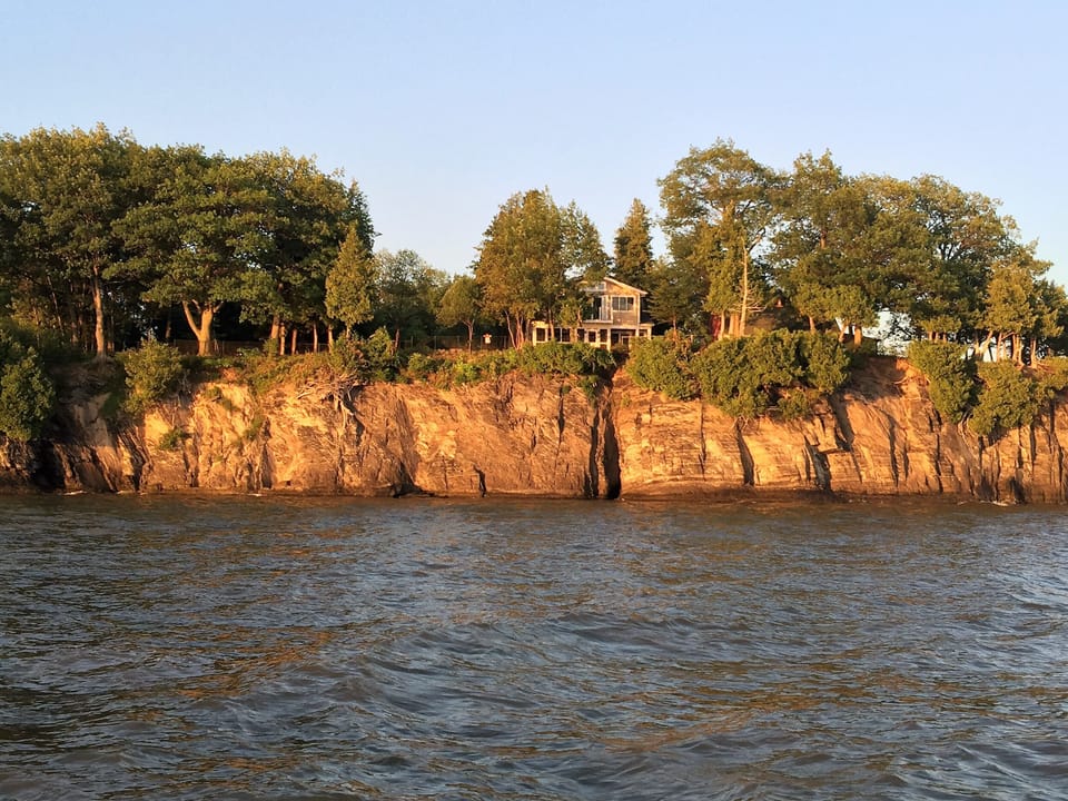 View of the Camp at Barney Point from Lake Champlain at dusk...
