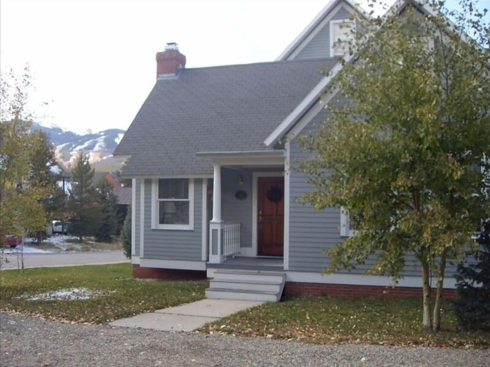 Front View of Cottage with Ski Slopes in the Background
