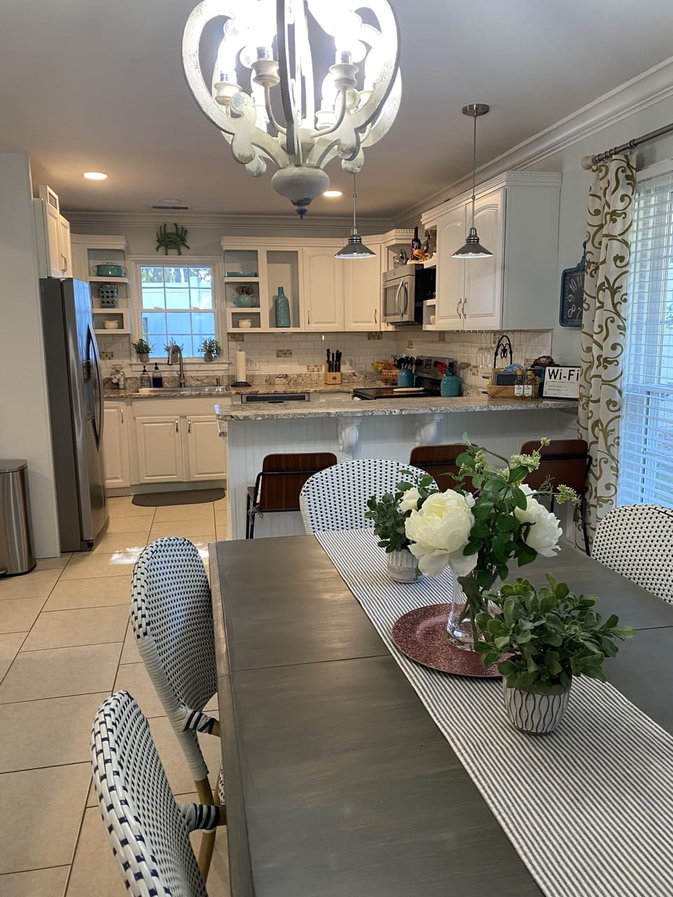 Dining room seating for 10 (with bar seating) open to great room and kitchen