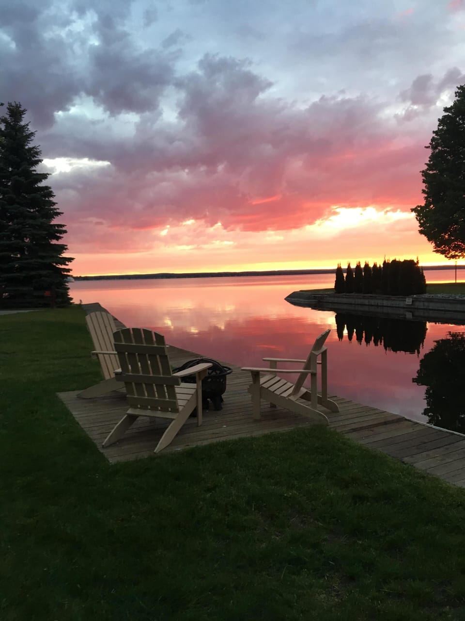 Experience spectacular sunrises from our lakeside deck or Adirondack chairs