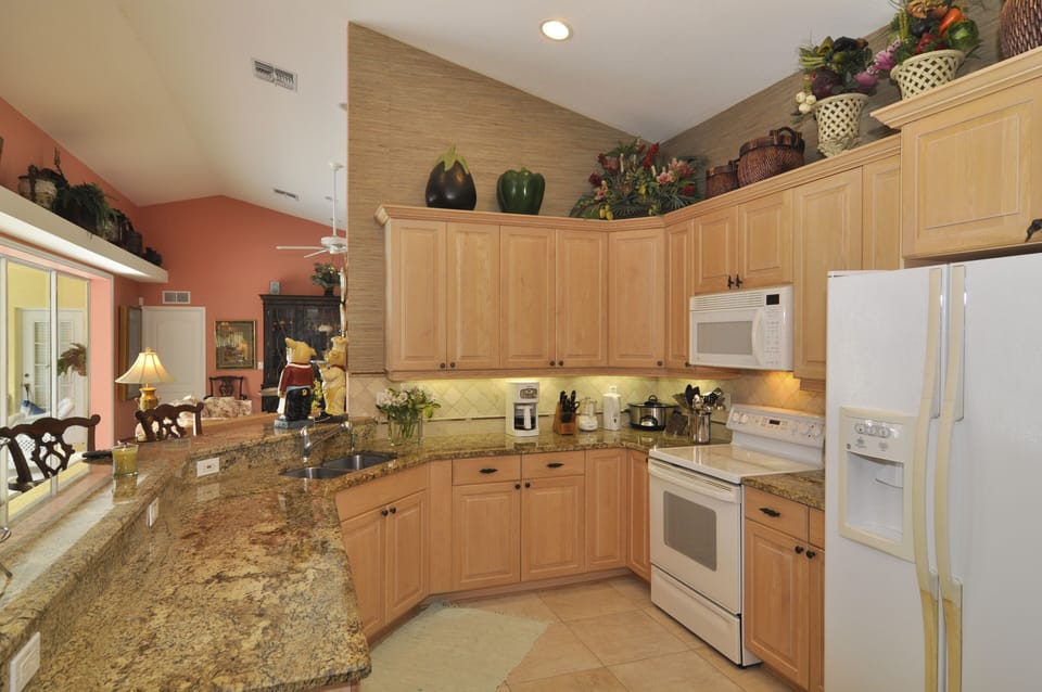 Open kitchen with granite bar and counters