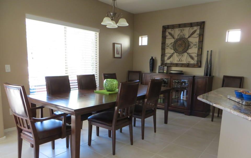 DINING AREA WITH  DINING SET THAT SEATS 8 COMFORTABLY